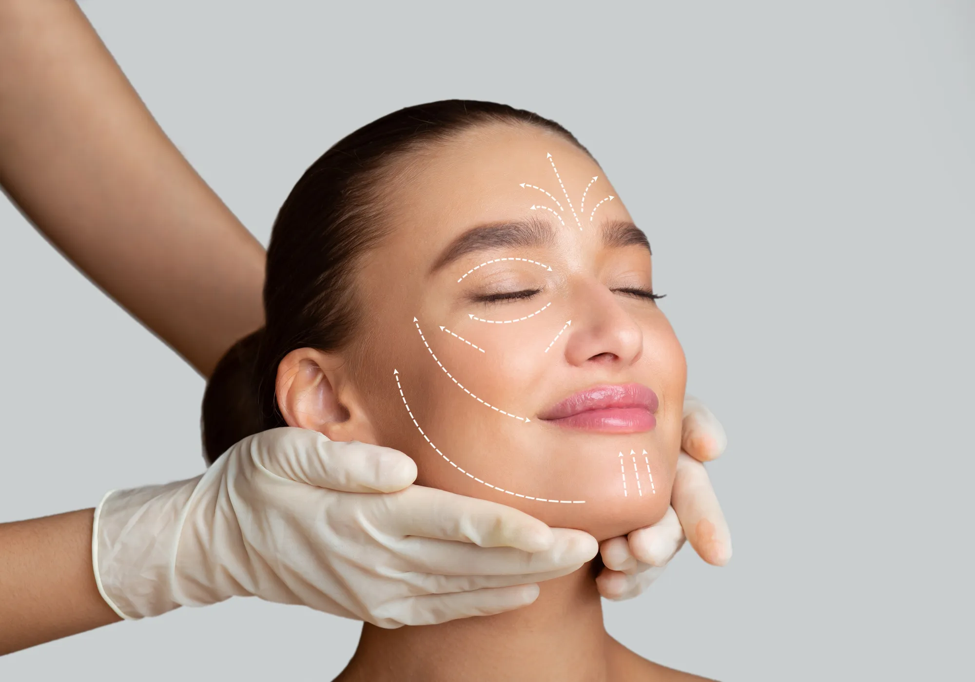Woman receiving a facial aesthetics assessment with guide lines
