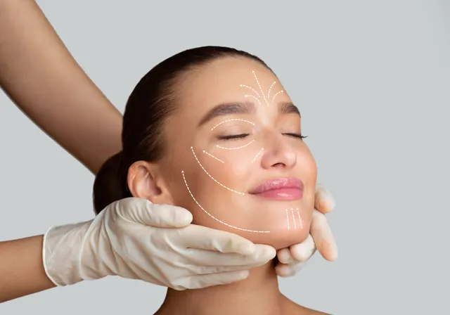 Woman receiving a facial aesthetics assessment with guide lines